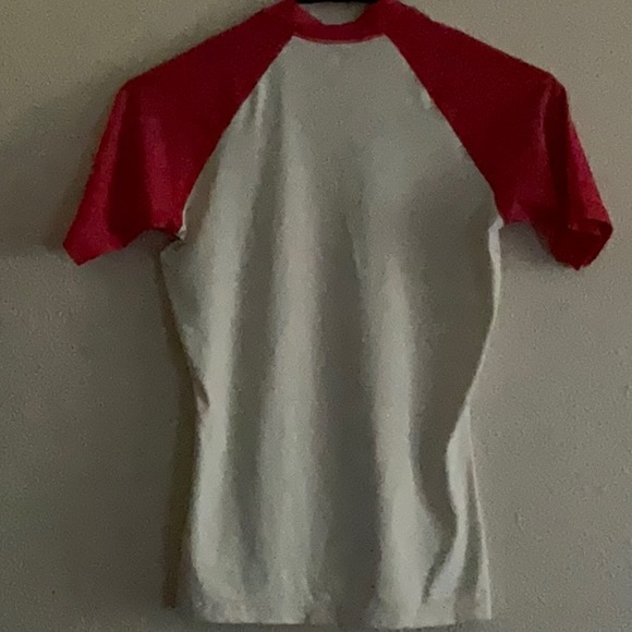 Small size, baseball inspired shirt. Fits snug. - Picture 2 of 2